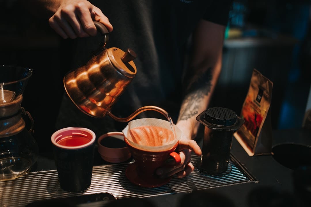 Artisan coffee preparation with warm editorial lighting