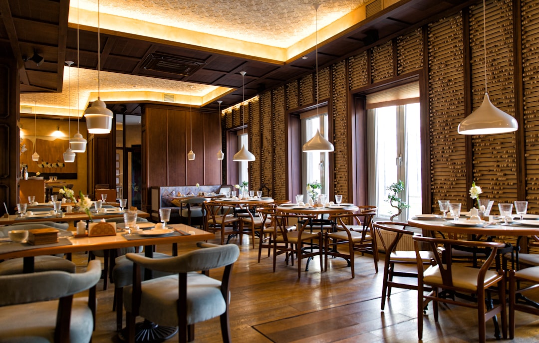 Elegant restaurant interior with warm ambient lighting and sophisticated dining atmosphere